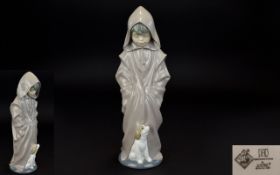 Nao by Lladro Porcelain Figure - Boy In Hooded Dressing Gown with Little Dog. 10.25 Inches Tall.