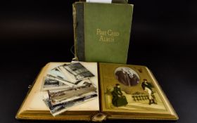 A Pair Of Antique Postcard And Photo Albums Two hard bound albums circa 1890's The first