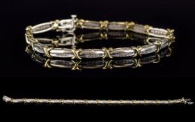 A Contemporary Designed Two Tone 9ct Gold Diamond Set Bracelet. Fully Hallmarked. Est Diamond Weight