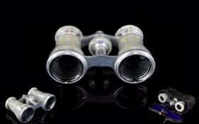 Antique Opera Glasses Housed in original case, silver tone binoculars with mother of pearl to outer.