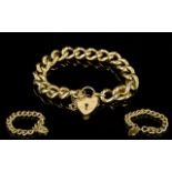 A Good Quality And Heavy 9ct Gold Curb Bracelet With Attached Safety Chain And Heart Shaped 9ct