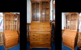 'Younger Furniture' Sectional Glazed Bureau .Comprising three bottom drawers, lockable pull down