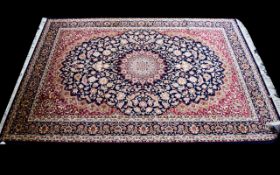 A Large Woven Silk Carpet Keshan rug with beige ground and traditional Middle Eastern floral and