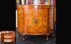 A 1920's Walnut Veneer Bow Front Cabinet Large two door cabinet in crescent from with ornate brass