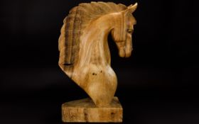 A Decorative Carved Wooden Horse Head Grecian Style carved horse head on wooden plinth with