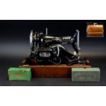 Vintage Singer Sewing Machine Finished in traditional black and gilt paint finish,