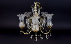 A Large Chandelier Five arm chandelier in brass tone with five fluted ,