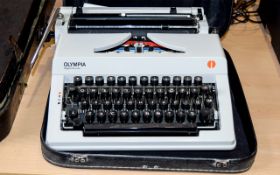 A Vintage Olympia Regina De Luxe Typewriter including carry case.