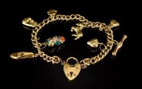 Antique 9ct Curb Bracelet Loaded with 8 9ct Gold Charms with Safety Chain and Padlock,