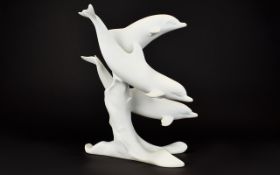 A Large Kaiser Germany Bisque Porcelain Dolphin Group Figure White porcelain figure depicting three