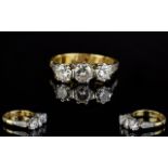 Ladies Attractive 18ct Yellow Gold And Platinum Clawset 3 Stone Diamond Ring With tubed shoulders