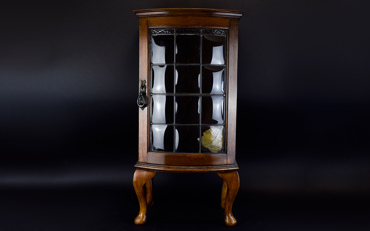 Small Oak Bow Fronted Cabinet, Leaded Glass Door (One Panel Broken) Raised On Short Cabriole Legs,