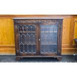 Oak Jacobean Style Carved Bookcase, leaded glazed front with 2 shelves. 36 inches high, 39 inches