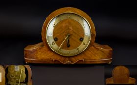 Art Deco Period Mantle Clock Wood cased arch top clock with brass tone dial and brass ball feet.