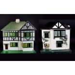 Two Two Tier Wooden Constructed Tudor Style Dolls Houses with a small amount of furniture.