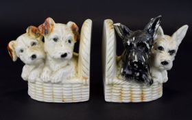 Two Antique Book Ends with Two breeds of Dogs on each side, small chip to ear.
