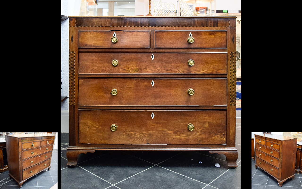 Antique Chest Of Drawers A large Edwardian chest of drawers with brass pull handles and inlaid