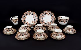 Staffordshire Part Teaset comprising 8 cups, saucers and side plates, a large sugar bowl and milk