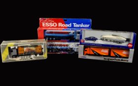 A Collection of boxed vehicles. 5 in total including 2 Esso Road Tankers, Siku Car With Motorboat,