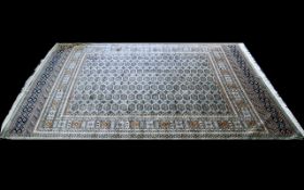 A Large Woven Silk Bokhara Carpet Ornate very large silk statement carpet with traditional lozenge