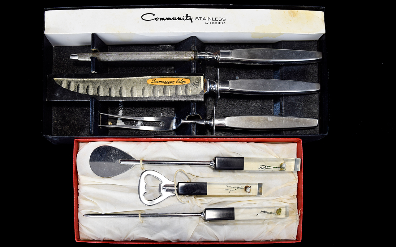 A Vintage Stainless Steel Carver Set By Oneida Boxed carving set to include carving knife, fork