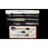 A Vintage Stainless Steel Carver Set By Oneida Boxed carving set to include carving knife, fork