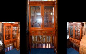 A Two Door Astral Glazed Display Cabinet. Feature two internal glass shelves, locking cupboard