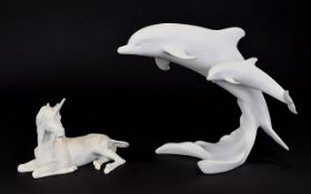 Two Kaiser Germany Bisque Porcelain Figures White porcelain figure depicting a Dolphins and calf