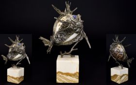 Modernist and Stylished Silver Sculpture of a Red Lion Fish with Cowry Shell Body.