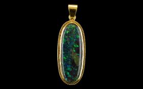 Large Black Opal Pendant Set In An 18ct Gold Mount With Rope Twist Border,