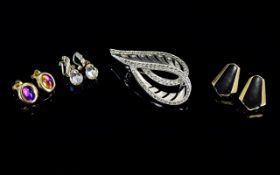 A Small Quantity Of Costume Jewellery Four items in total to include 1940's silver tone leaf brooch