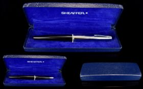 Sheaffer Fountain Pen. Black and Chrome with Box and Papers. Good Condition and Working Order.