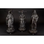 Three Resin Figures In The Form Of Chinese Gods Three figures in ebonised finish each on oval