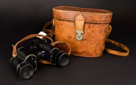 World War II Pair of Military Painted Black on Brass Binoculars, with Leather Holding Strap.