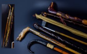 A Collection Of Antique Walking Sticks, Golf Putter And Fishing Rod Seven items in total to