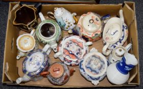 A Collection Of Antique Ceramic Teapots