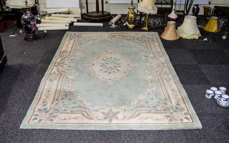 A Large Oriental Style Wool Blend Rug Re