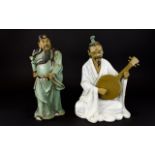 A Pair Of Oriental Figures The first fas
