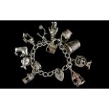 Silver Curb Bracelet Loaded with 12 Good Quality Silver Charms. All Marked for Silver. c.