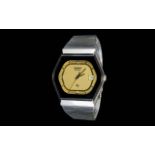 Rado Quartz Wristwatch with hexagonal face, stainless steel watch and gold dial.