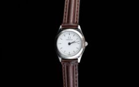 Ladies Omega Wristwatch with brown leather strap white dial and baton numerals.