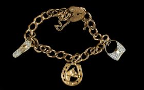 9ct Yellow Gold Bracelet Loaded with 3 Charms. All Marked 9ct Gold with 9ct Gold Padlock. 11.