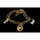 9ct Yellow Gold Bracelet Loaded with 3 Charms. All Marked 9ct Gold with 9ct Gold Padlock. 11.