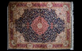 A Large Woven Silk Carpet Keshan rug with midnight blue ground and traditional Middle Eastern