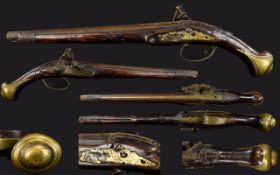 Flintlock Pistol, Carved Walnut, Brass Mounts, Length 19½ Inches.
