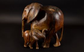 Antique Hand Carved Elephant Figure A large wood figure with aged patina in the form of an African