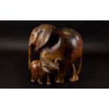 Antique Hand Carved Elephant Figure A large wood figure with aged patina in the form of an African