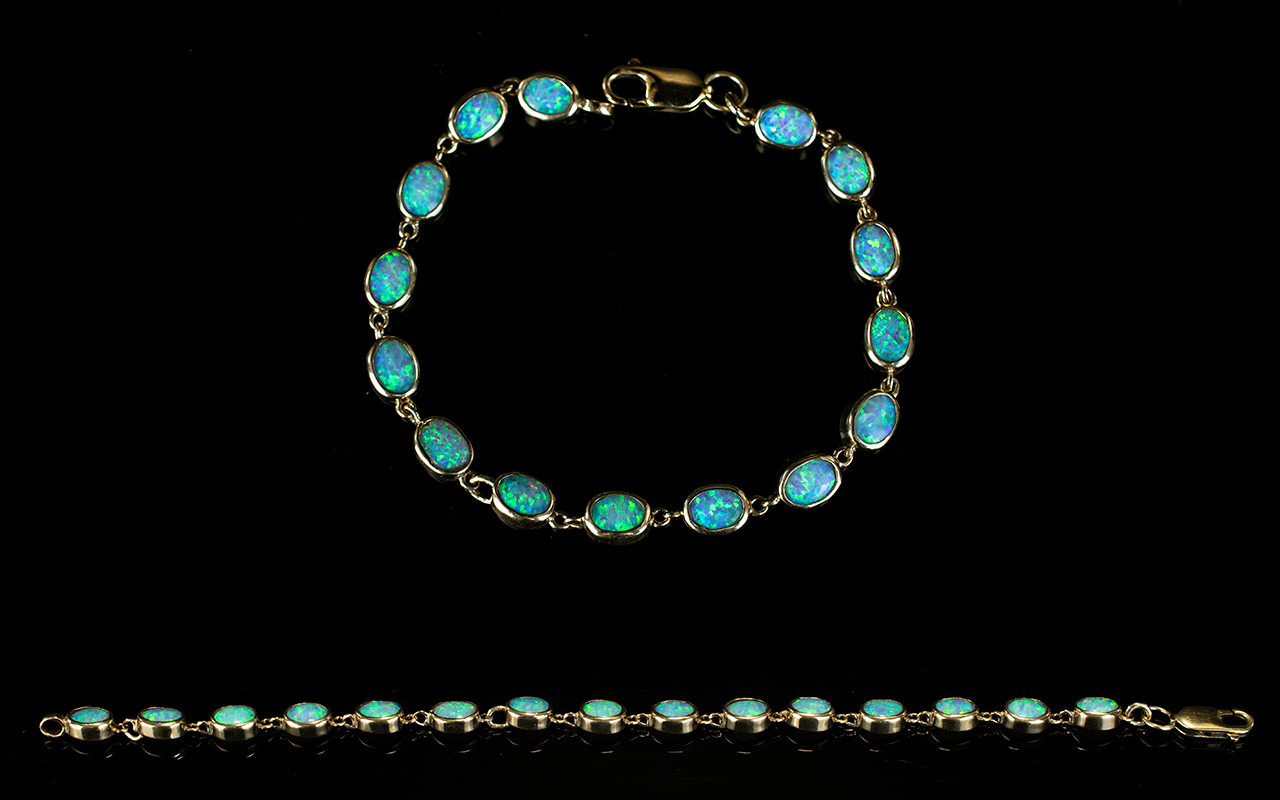 9ct Gold - Nice Quality Opal Set Bracelet, Set with 15 Opals of Good Colour.