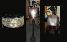 A Decorative Armour Breastplate And French WWI Veteran Of The Great War Adrian Helmet Floor