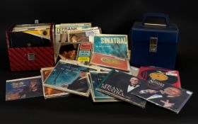 A Collection of 45 Vinyl Single Records includes Frank Sinatra, Elton John, Nancy Sinatra,